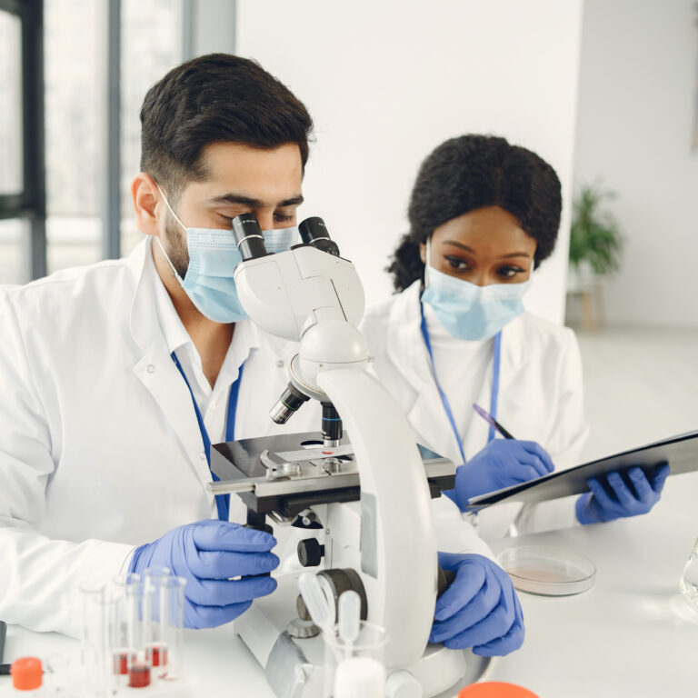 researchers creating vaccine for covid 19 in a lab